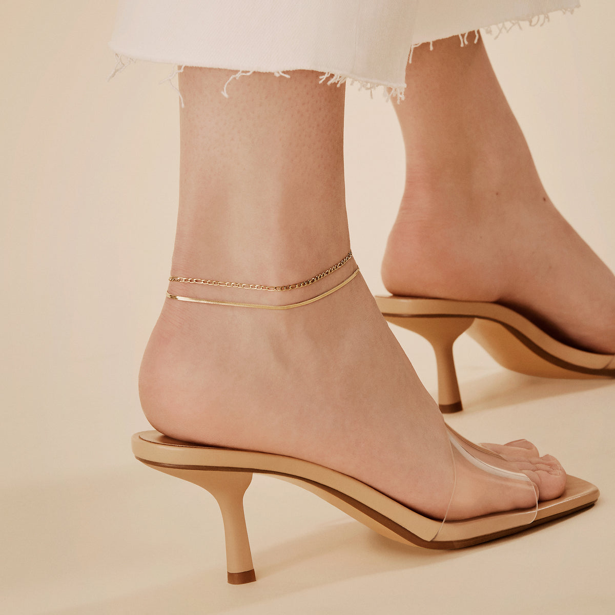 gold flat and figaro ankle chains stacking