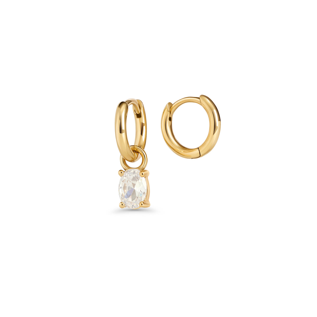 Gold hoop earrings with an oval clear stone pendant in a prong setting on a white background. 2-in-1. Jewelry by Mia Bijoux Canada.

Boucles d'oreilles anneaux dorées avec pendentif serti sur griffes d'une pierre transparente ovale sur fond blanc. 2-in-1. Bijoux par Mia Bijoux Canada.